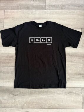 Organic Basics Black Tee with White 'NiCeAsS' Graphic